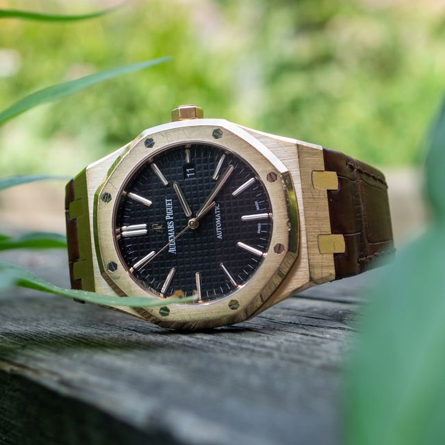 Men's wrist watch on a wooden surface