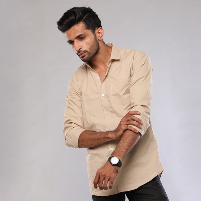 Man wearing a beige long-sleeve shirt